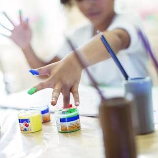 Children’s hands finger painting